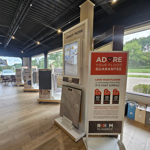 showroom with adore your floor sign